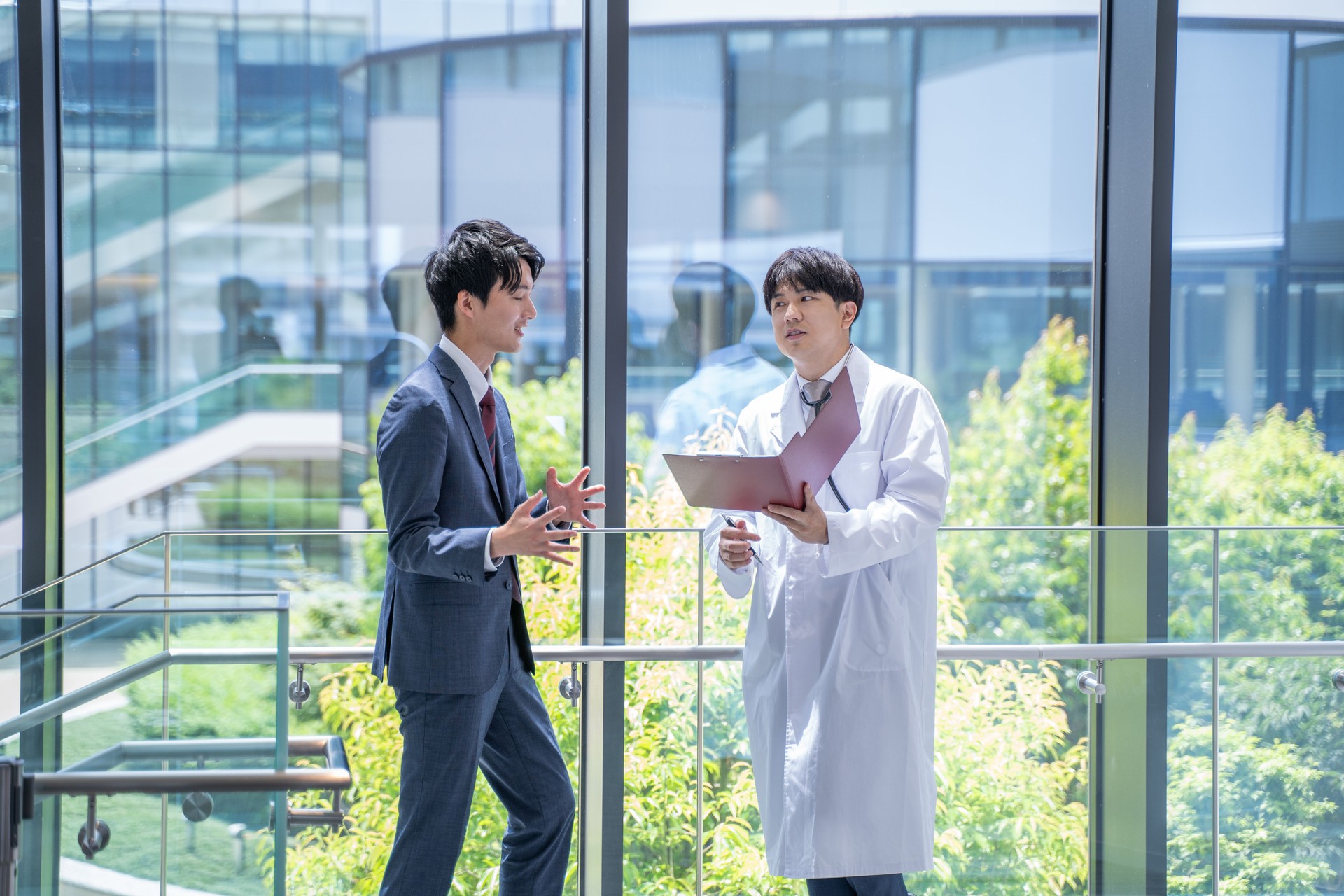 Doctor and businessman having a meeting at the hospital